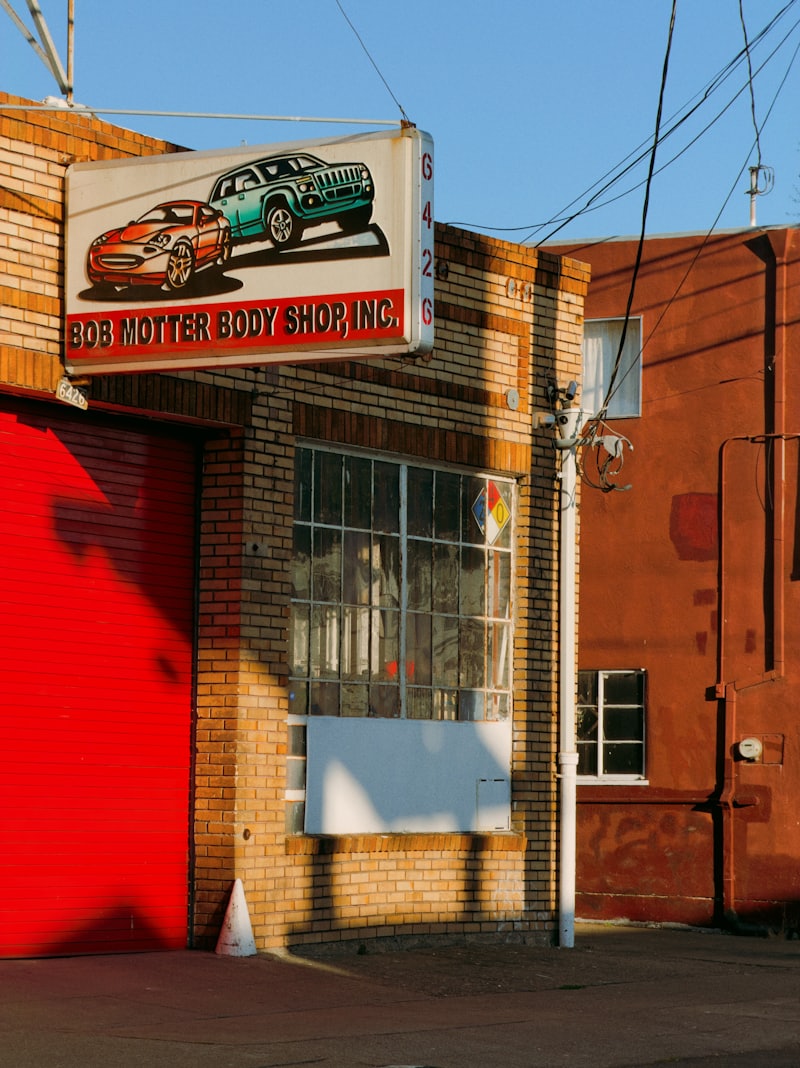 Auto body shop storefront with a flat commercial roof